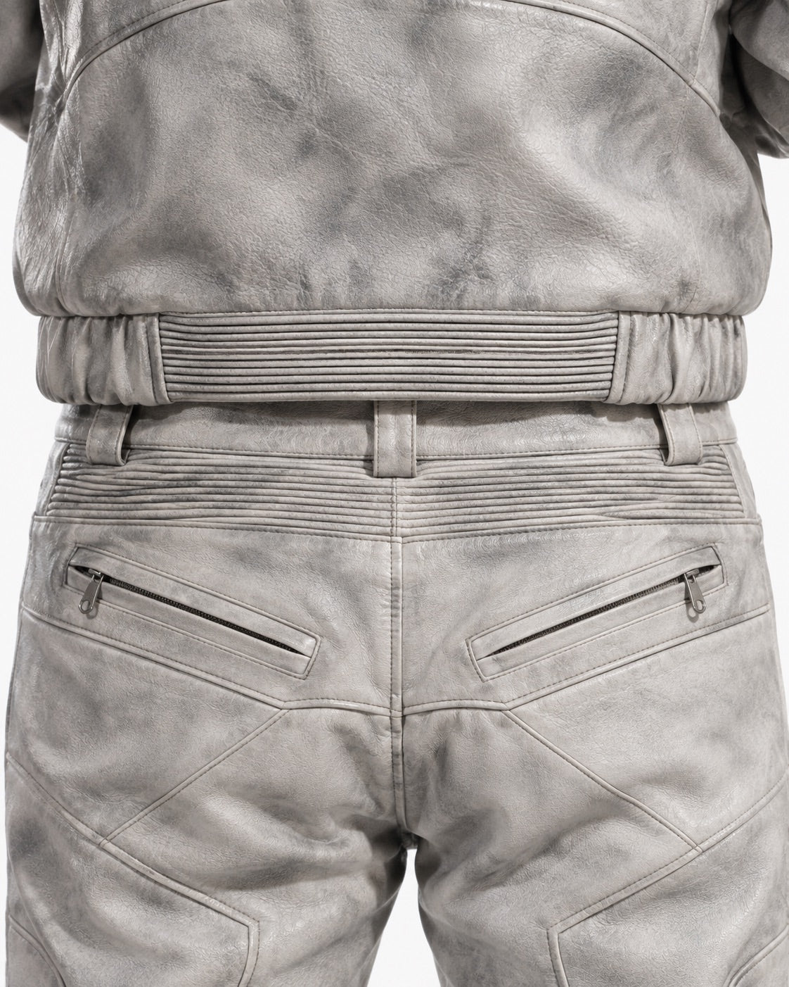 Dirt-White leather set back detail showing ribbed panels and zip pockets